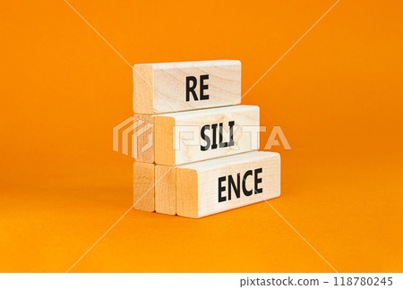 Resilience symbol. Concept word Resilience on beautiful wooden blocks. Beautiful orange background. Business resilience concept. Copy space. Resilience symbol. Concept word Resilience on beautiful wooden blocks. Beautiful orange background. Business resilience concept. Copy space. 118780245