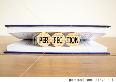 Perfection symbol. Concept word Perfection on beautiful wooden circles in book. Beautiful wooden table white background. Business perfection concept. Copy space. Perfection symbol. Concept word Perfection on beautiful wooden circles in book. Beautiful wooden table white background. Business perfection concept. Copy space. 118780281