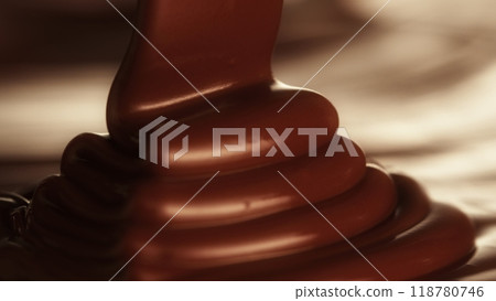 Macro Shot of Pouring Hot Melted Chocolate in Close-up. Macro Shot of Pouring Hot Melted Chocolate in Close-up. 118780746