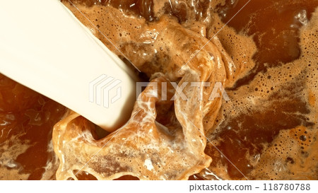 Macro Shot of Milk Mixing with Coffee Drink in Detail. 118780788