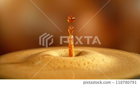 Dripping Drop into Coffee Drink in Detail. 118780791