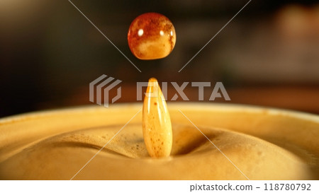 Dripping Drop into Coffee Drink in Detail. Dripping Drop into Coffee Drink in Detail. 118780792
