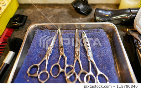 Scissors and a boy at a beauty salon 118780840