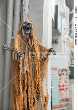 Hanging ghost with chain on wrists decor at Haji Lane, Singapore Hanging ghost with chain on wrists decor at Haji Lane, Singapore 118780880