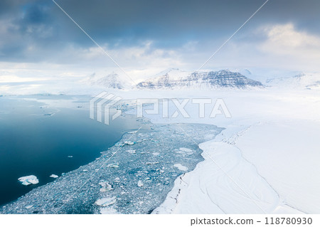 Iceland. An aerial view of an iceberg. Winter landscape from a drone. Jokulsarlon Iceberg Lagoon 118780930