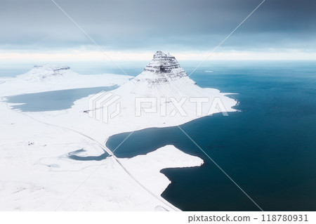 Kirkjufell mountain, Iceland. Aerial view of the mountain and road.  118780931