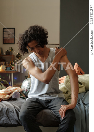 Guy with hangover touching shoulder 118781274