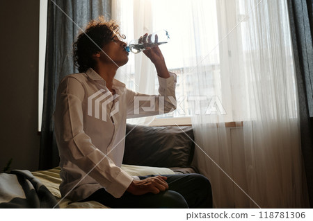 Guy having refreshment after booze 118781306