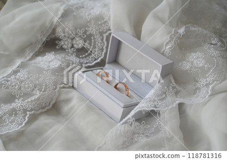 Gold wedding rings in a box on lace Gold wedding rings in a box on lace 118781316