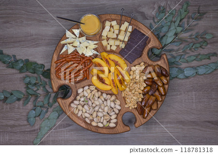 Appetizer on wooden wine table with eucalyptus decor 118781318