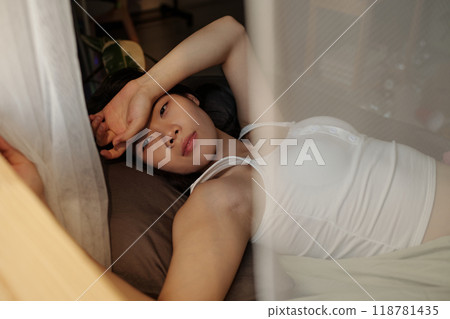 Young woman with headache and hangover 118781435