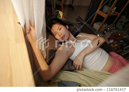 Looking through window in the morning 118781437