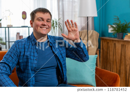 POV of man looking at camera making video webcam conference call with friends or family waving hello 118781452