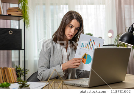 Business woman working on laptop at office online communication video call graphical analytics 118781602