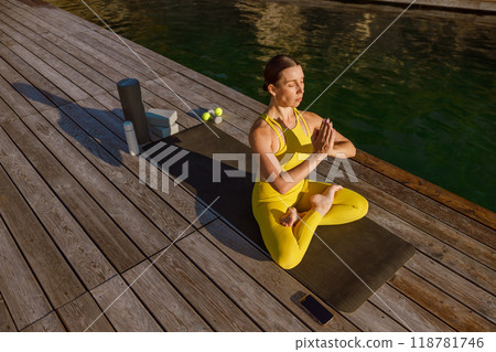 Engaging in Yoga Practice by the Water Experience True Serenity in Motion for Mindfulness 118781746