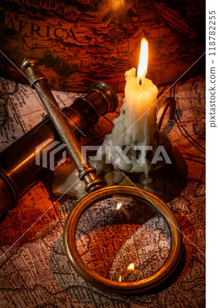 Vintage style travel and adventure. Vintage old compass and other vintage items on the table. 118782255