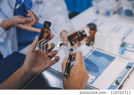 international team of professional doctors having a meeting in conference room at the modern hospital. Healthcare and medical development concept. 118782311