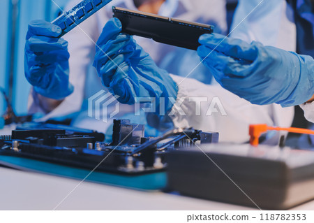 Electronics technician, electronic engineering electronic repair, electronics measuring and testing, repair and maintenance concepts. Electronics technician, electronic engineering electronic repair, electronics measuring and testing, repair and maintenance concepts. 118782353