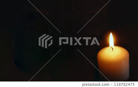 lit candle with black background lit candle with black background 118782475