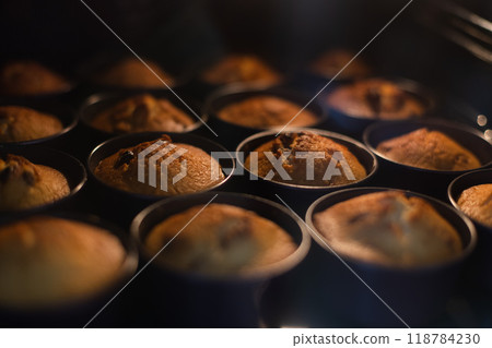 Cupcakes in oven in cookie cutters. Selective focus. 118784230