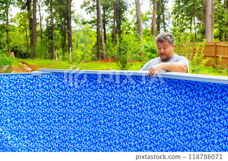 Installation of construction ground swimming pools at house in backyard Installation of construction ground swimming pools at house in backyard 118786071