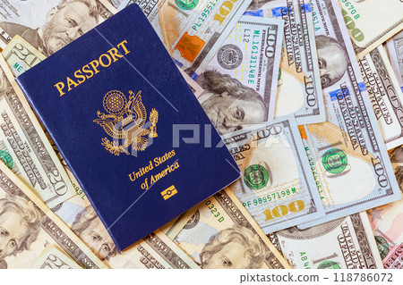There is nominal difference between US passport on top of US currency American dollar cash banknotes There is nominal difference between US passport on top of US currency American dollar cash banknotes 118786072