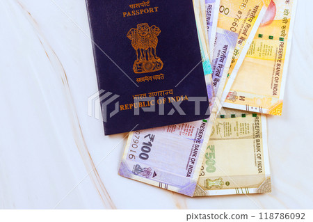 Republic of India passport on Indian rupees of various denominations is accompanied by a currency banknotes Republic of India passport on Indian rupees of various denominations is accompanied by a currency banknotes 118786092