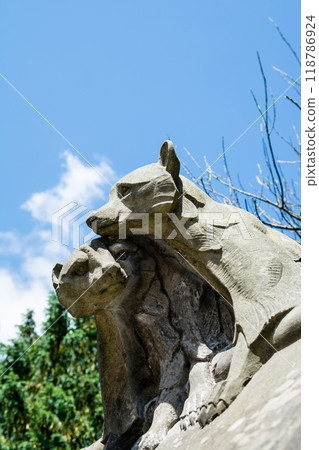 A stone sculpture of a little bear on the walls of Cardiff Castle in Cardiff, the capital of Wales. 118786924