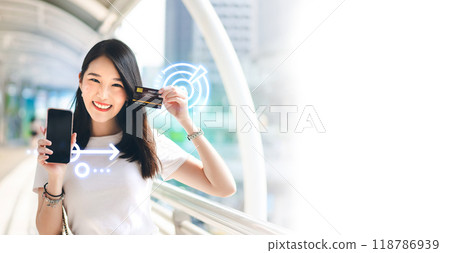 Young adult business woman consumer holding smartphone background with copy space 118786939