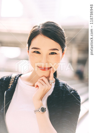 Vertical portrait of young adult beautiful asian business working woman on day 118786948
