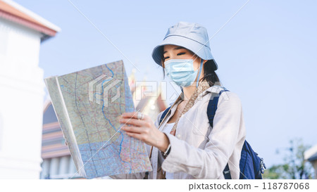 Young adult asian traveller woman travel in city using maps at Bangkok Thailand 118787068