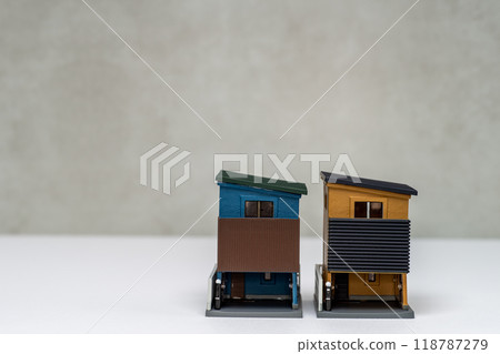 Image of a three-story house with a sloping roof 118787279