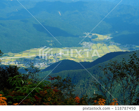 Autumn rural scenery seen from a mountain covered in autumn leaves 118787450