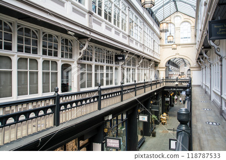 Shops seen from the upper floor of a historic glass-roofed arcade in Cardiff, the capital of Wales 118787533
