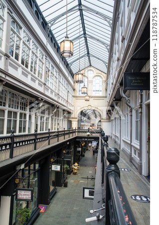 Shops seen from the upper floor of a historic glass-roofed arcade in Cardiff, the capital of Wales Shops seen from the upper floor of a historic glass-roofed arcade in Cardiff, the capital of Wales 118787534