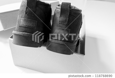 Fashionable modern short UGG boots made of sheep fur for the winter. Fashionable modern short UGG boots made of sheep fur for the winter. 118788690