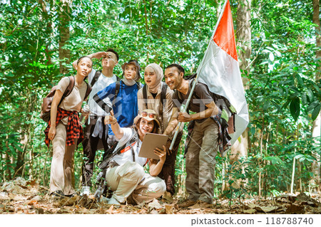 young travelers exploring forest together 118788740