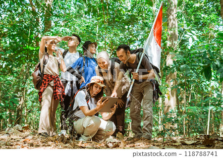 young asian traveler explore forest searching route 118788741