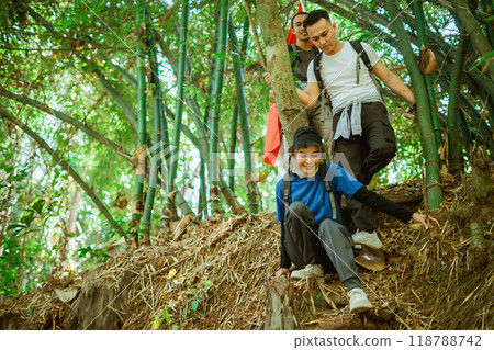 female hijab traveler climbing down mountain male friends 118788742