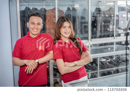 leather shoes store employees standing with crossed arm and smiling face 118788806