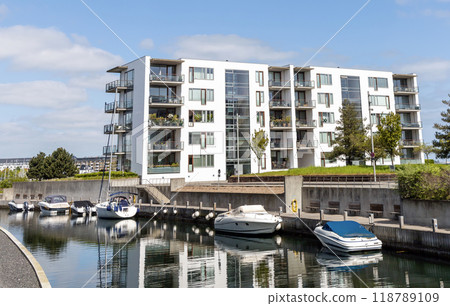 Modern and expensive area in Copenhagen with new luxury houses and a pier for yachts. Modern and expensive area in Copenhagen with new luxury houses and a pier for yachts. 118789109