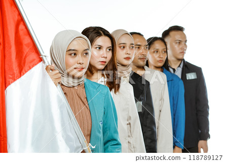 college student standing looking sideways holding indonesian flag 118789127