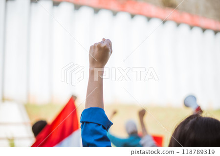 Raising Fists in Unity A Powerful Protest Scene Celebrating Togetherness and Justice Raising Fists in Unity A Powerful Protest Scene Celebrating Togetherness and Justice 118789319