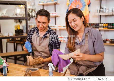 female and male worker drying boots and heels 118789609