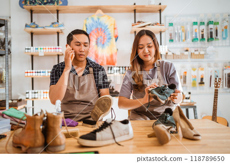 male worker holding phone getting phone call male worker holding phone getting phone call 118789650