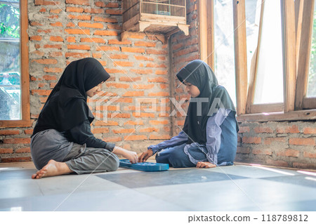 native indonesian girls playing traditional games native indonesian girls playing traditional games 118789812