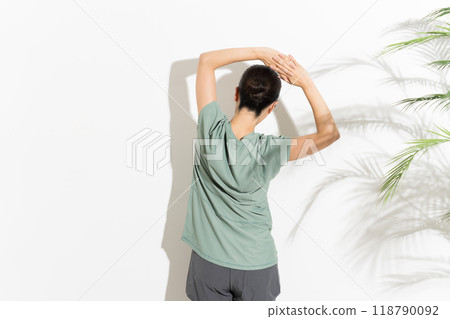 A woman doing flexibility exercises 118790092