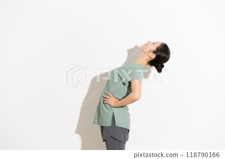 A woman doing flexibility exercises 118790166