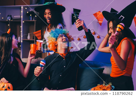 Joyful office Halloween party with coworkers in costumes, celebrating with drinks and laughter, fostering teamwork and festive spirit 118790262