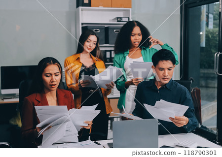 Stress, business people and employee frustrated with multitasking, pressure or overworked by team in chaos with paperwork. Anxiety, headache and worker overwhelmed by group and burnout in crisis 118790301